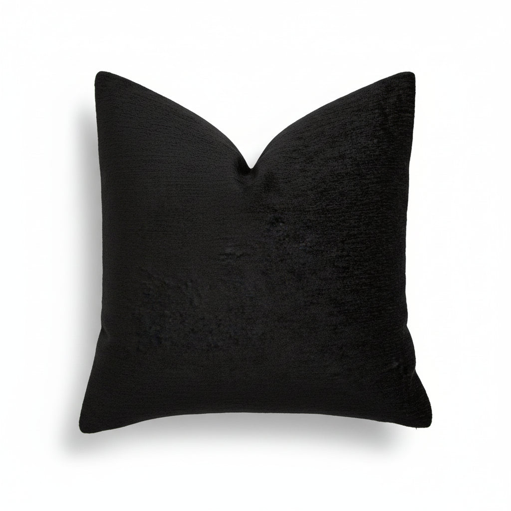 Black chenille throw pillow with a soft, textured finish