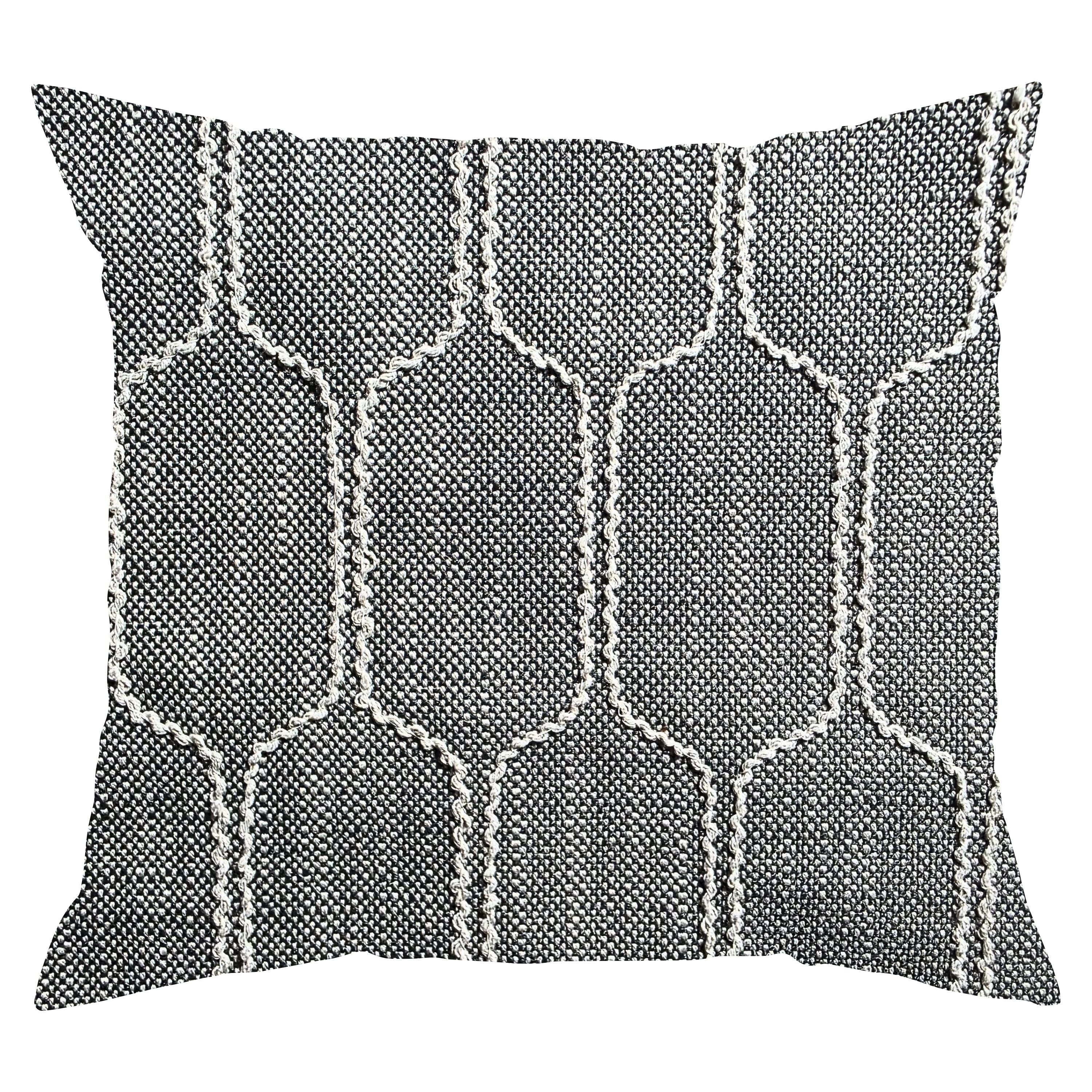 Decorative pillow with geometric pattern on a white background