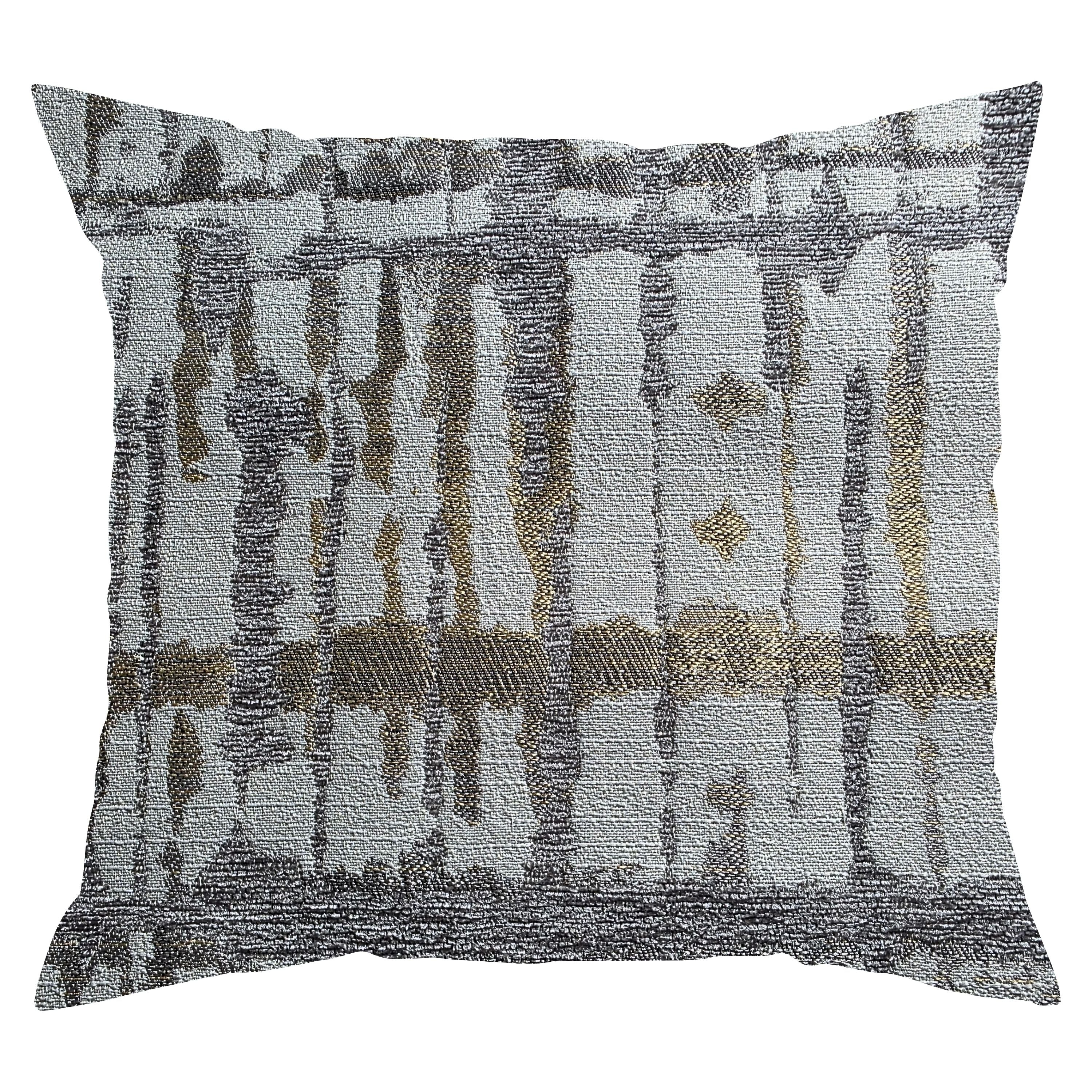 Textured pillow with abstract pattern on a white background