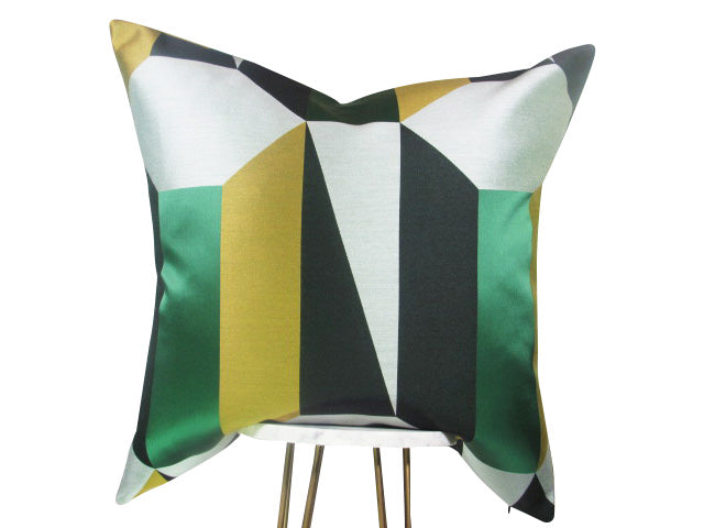A square-shaped throw pillow with a geometric pattern featuring abstract designs in green, tan, black, and silver colors, showcased on a simple background.