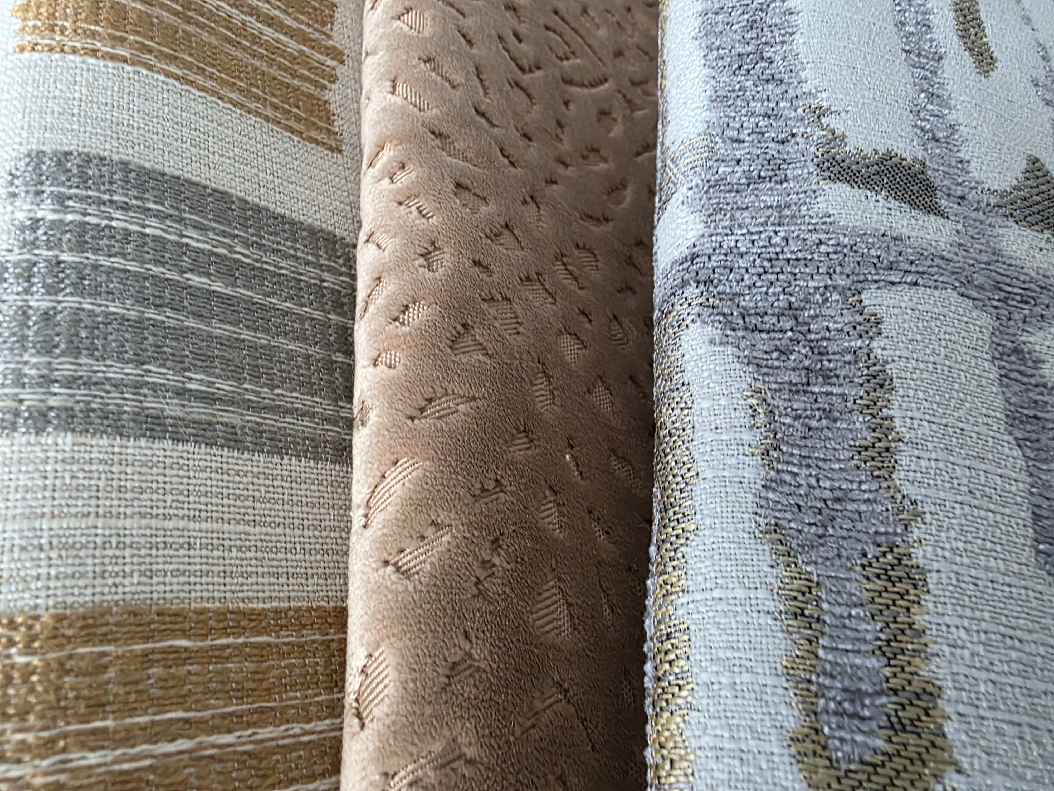 Three different textured fabric swatches arranged side by side.