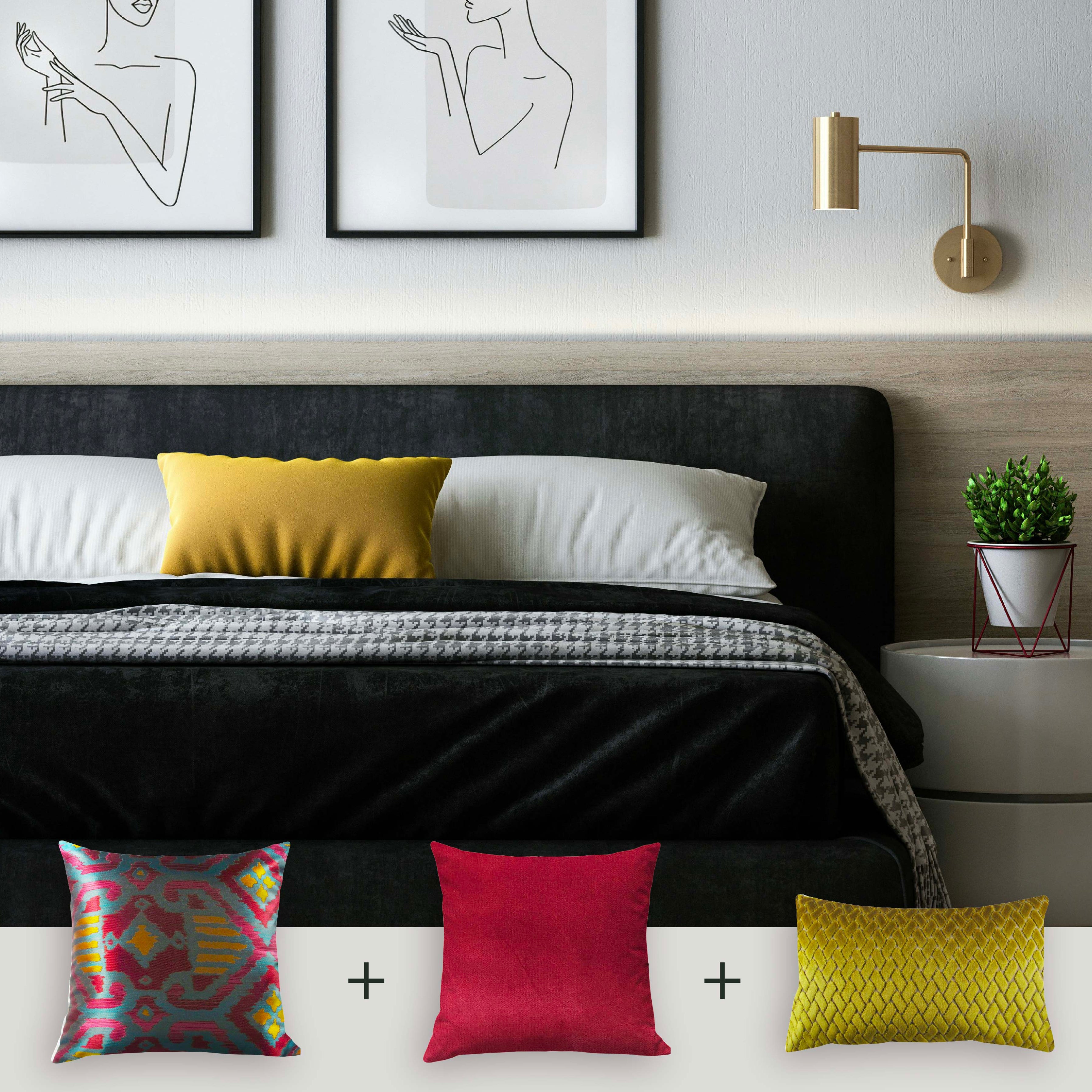 Modern bedroom with a bed featuring colorful pillows and wall art.