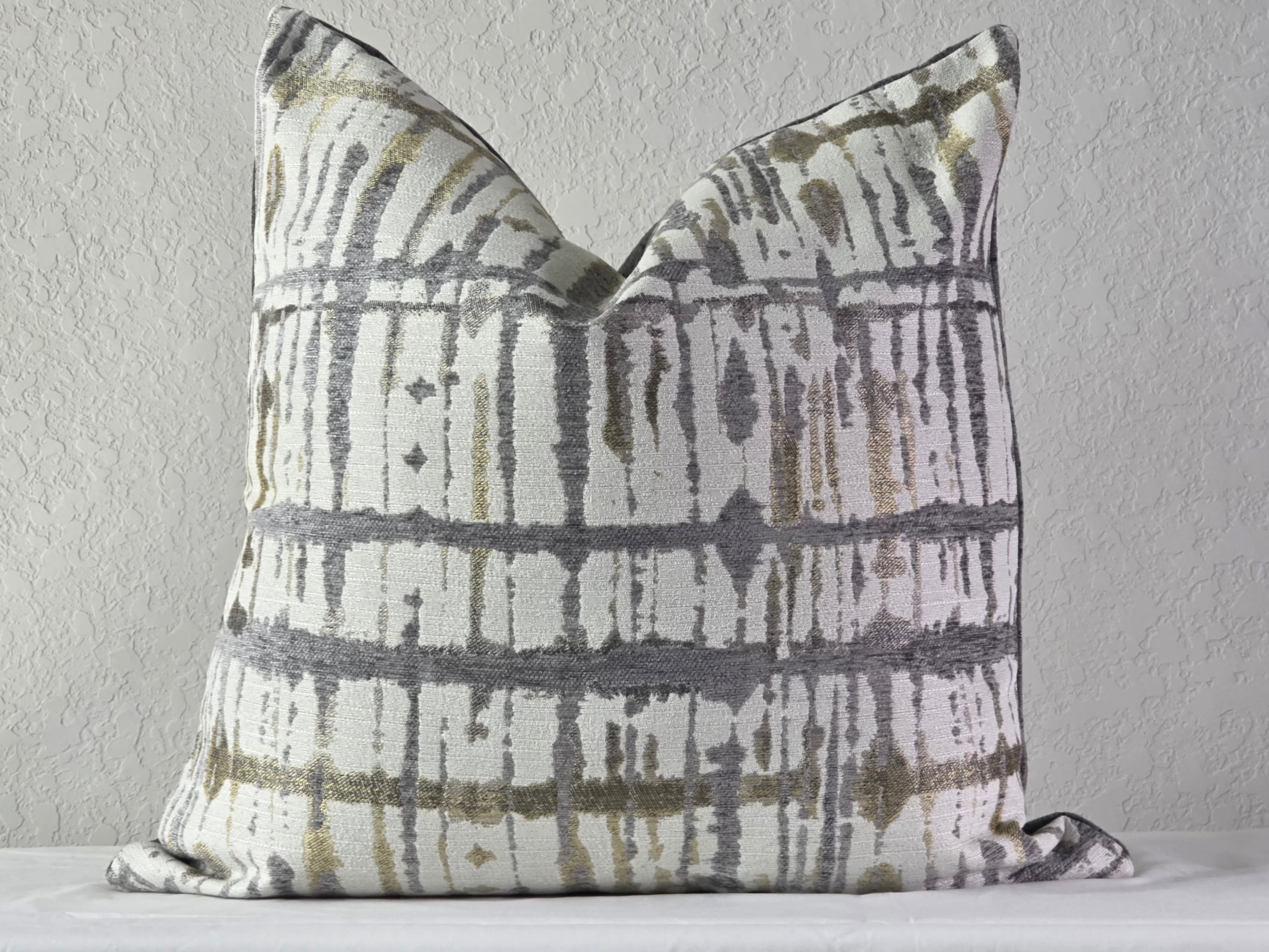 Decorative pillow with a pattern on a plain background