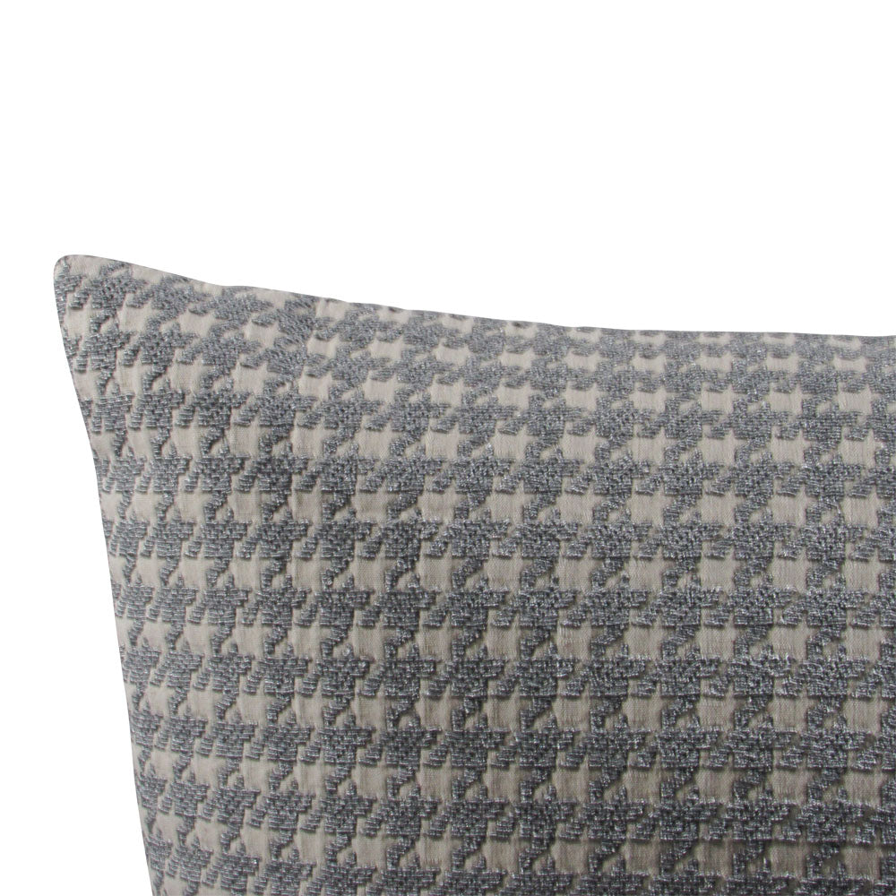 up-close view of off white and light gray throw pillow with houndstooth design.