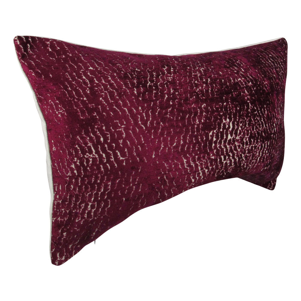 sideview of a fuchsia and cream 13x21 rectangle throw pillow with rippled design throughout.