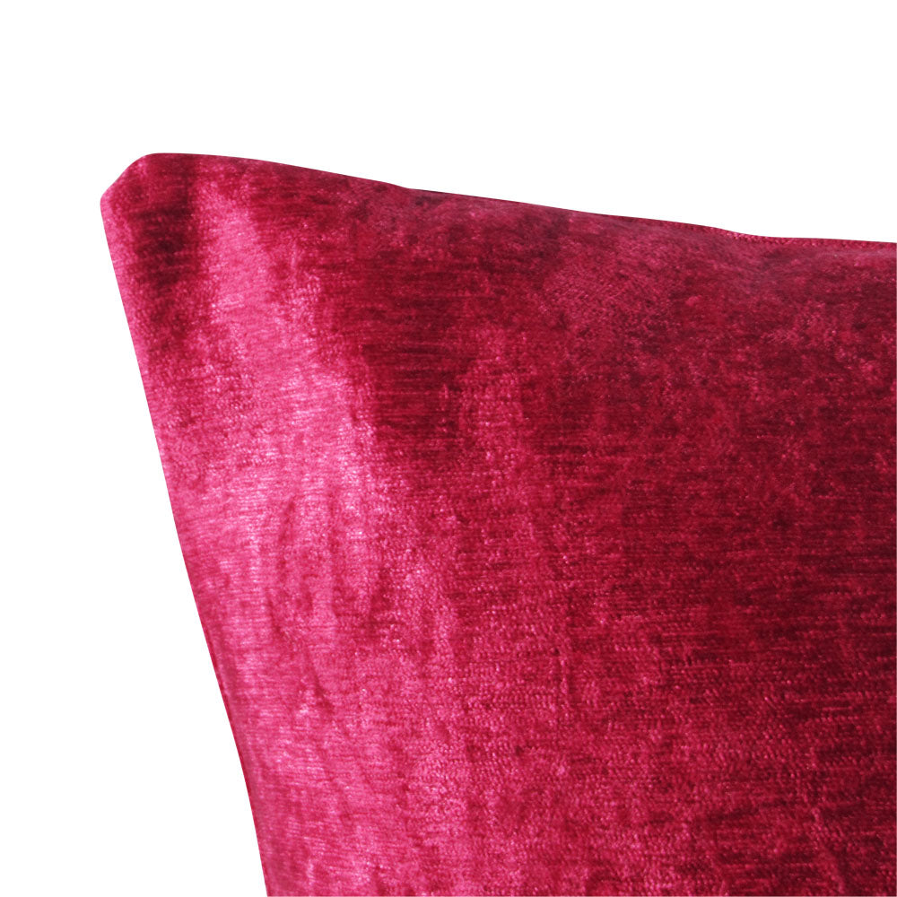 up-close view of a shiny velvet hot pink throw pillow.