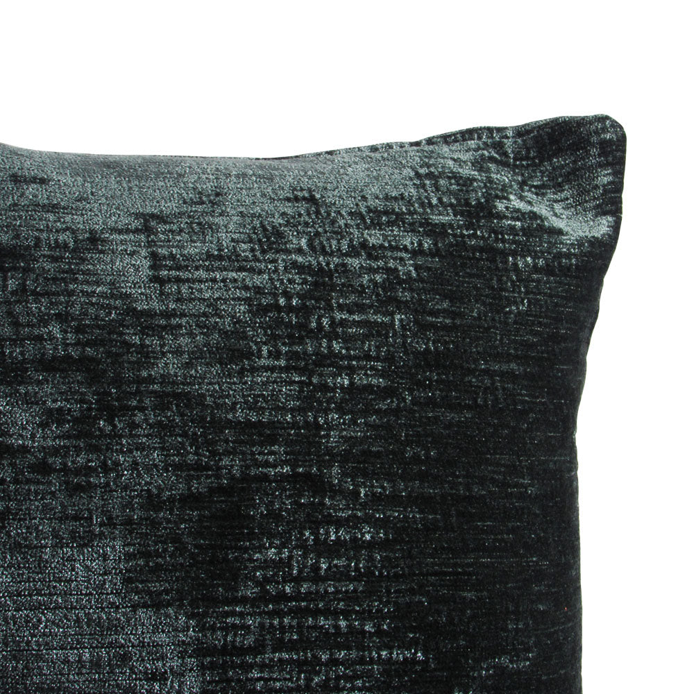 up-close view of a shiny velvet forest green throw pillow.
