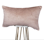 Textured pink pillow on a white background