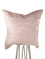 Textured pink pillow on a white background