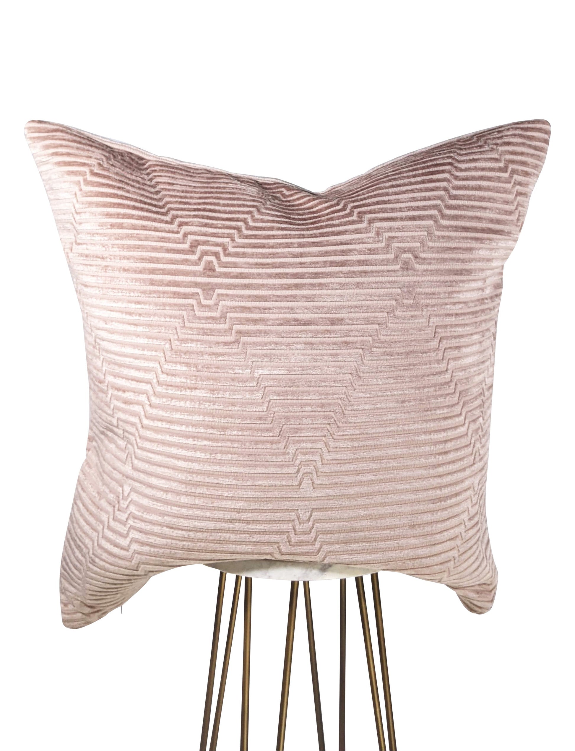 Textured pink pillow on a white background