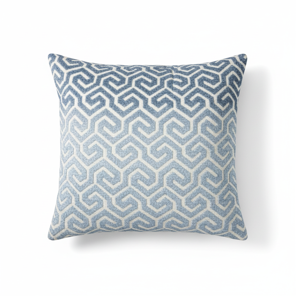 Decorative pillow with blue geometric pattern on a white background