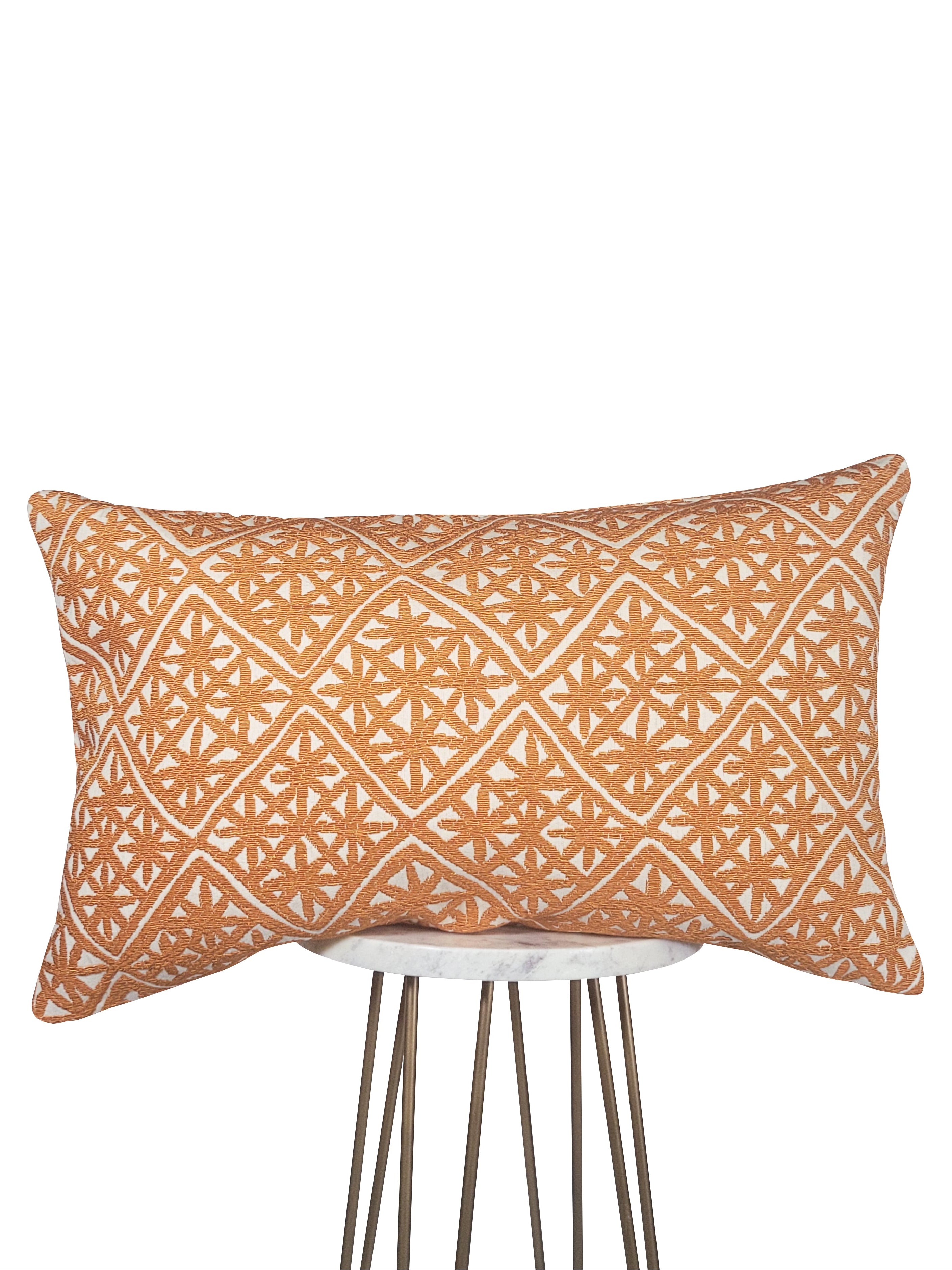 Decorative pillow with geometric pattern on a white background