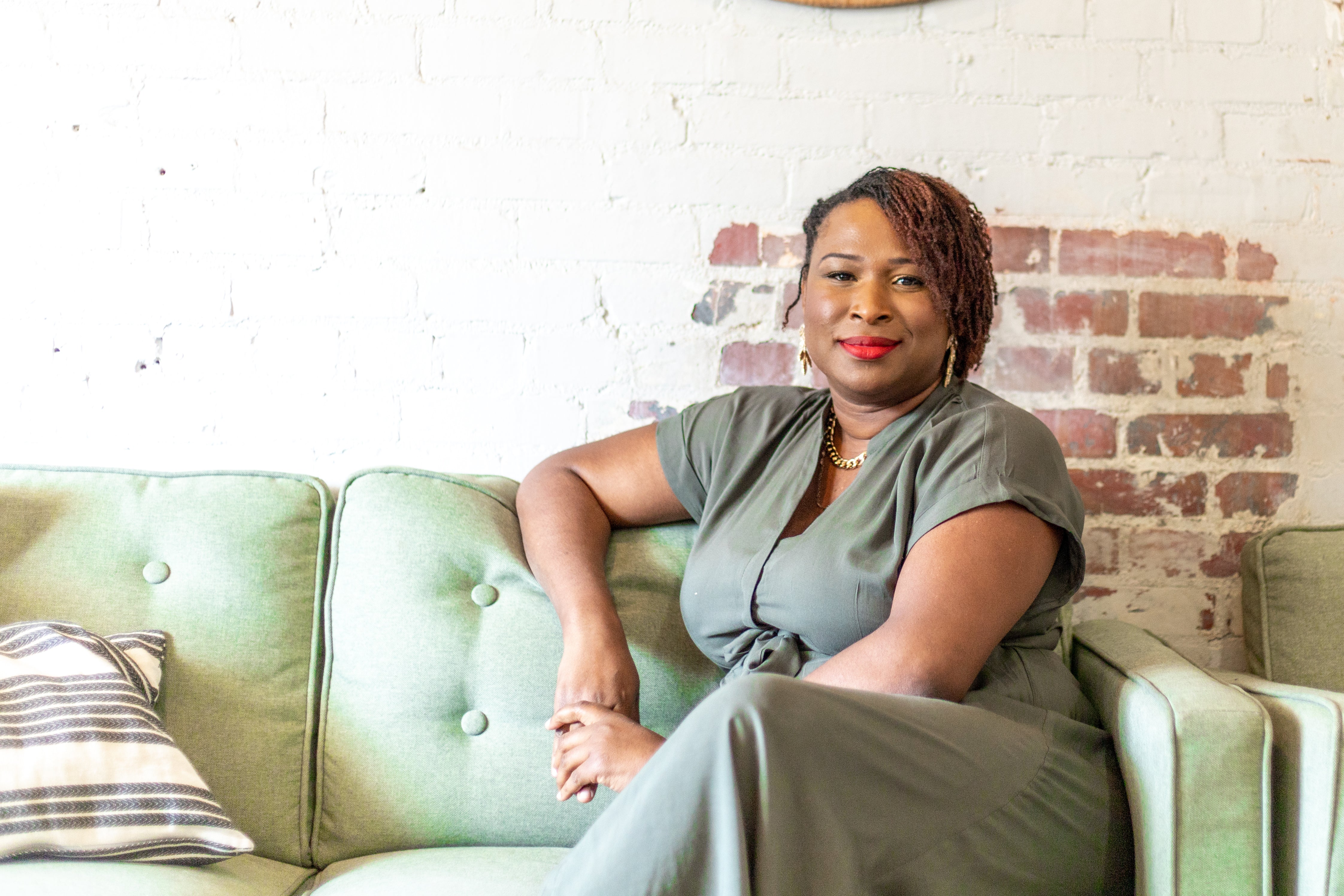 Nayvette Creative Director of Makena Decor styling luxury living room textiles
