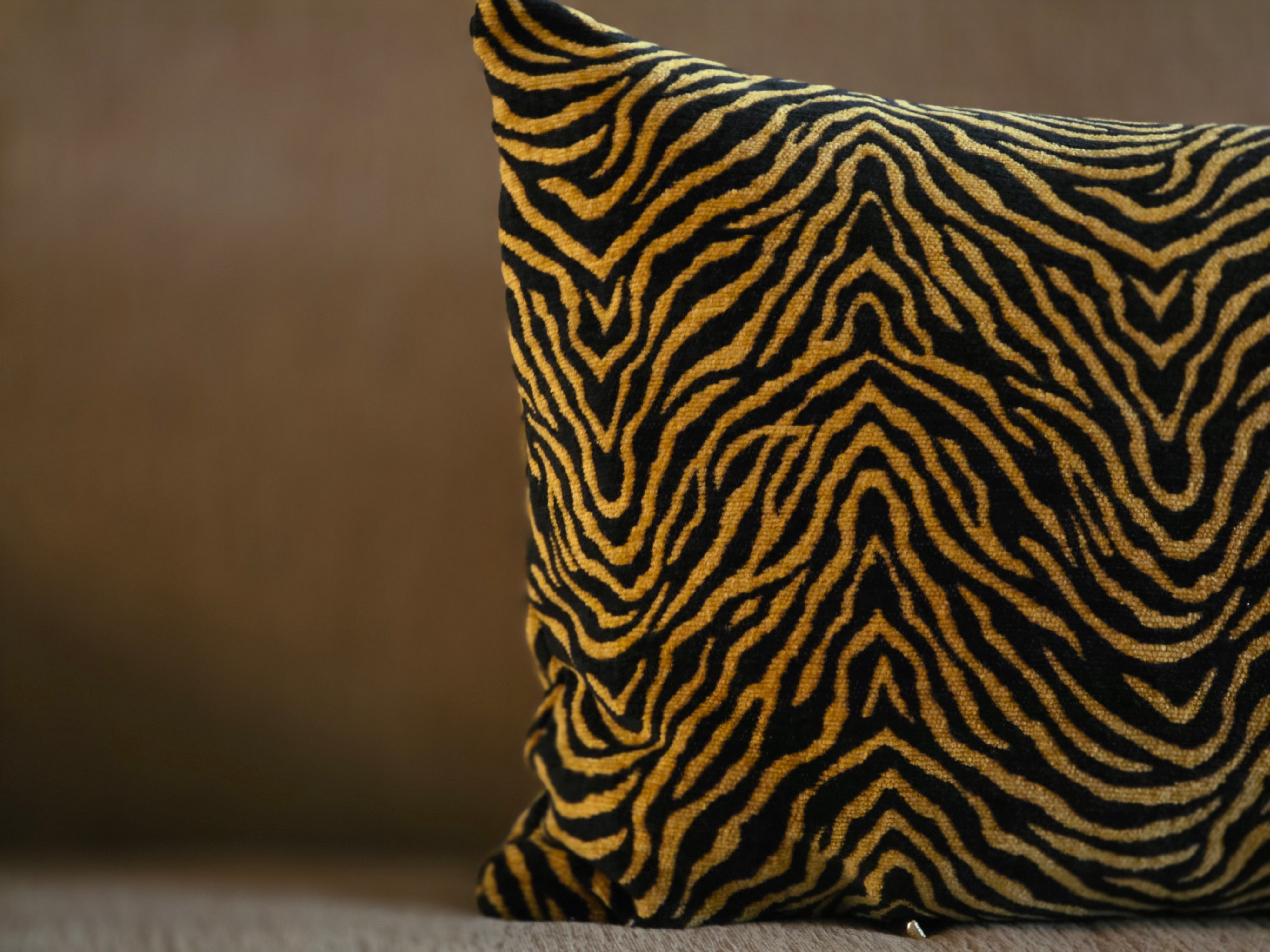 Zebra-striped pillow on a neutral background