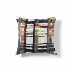 A square-shaped throw pillow with a vertical lines pattern in dark blue, gold, and burnt orange colors.