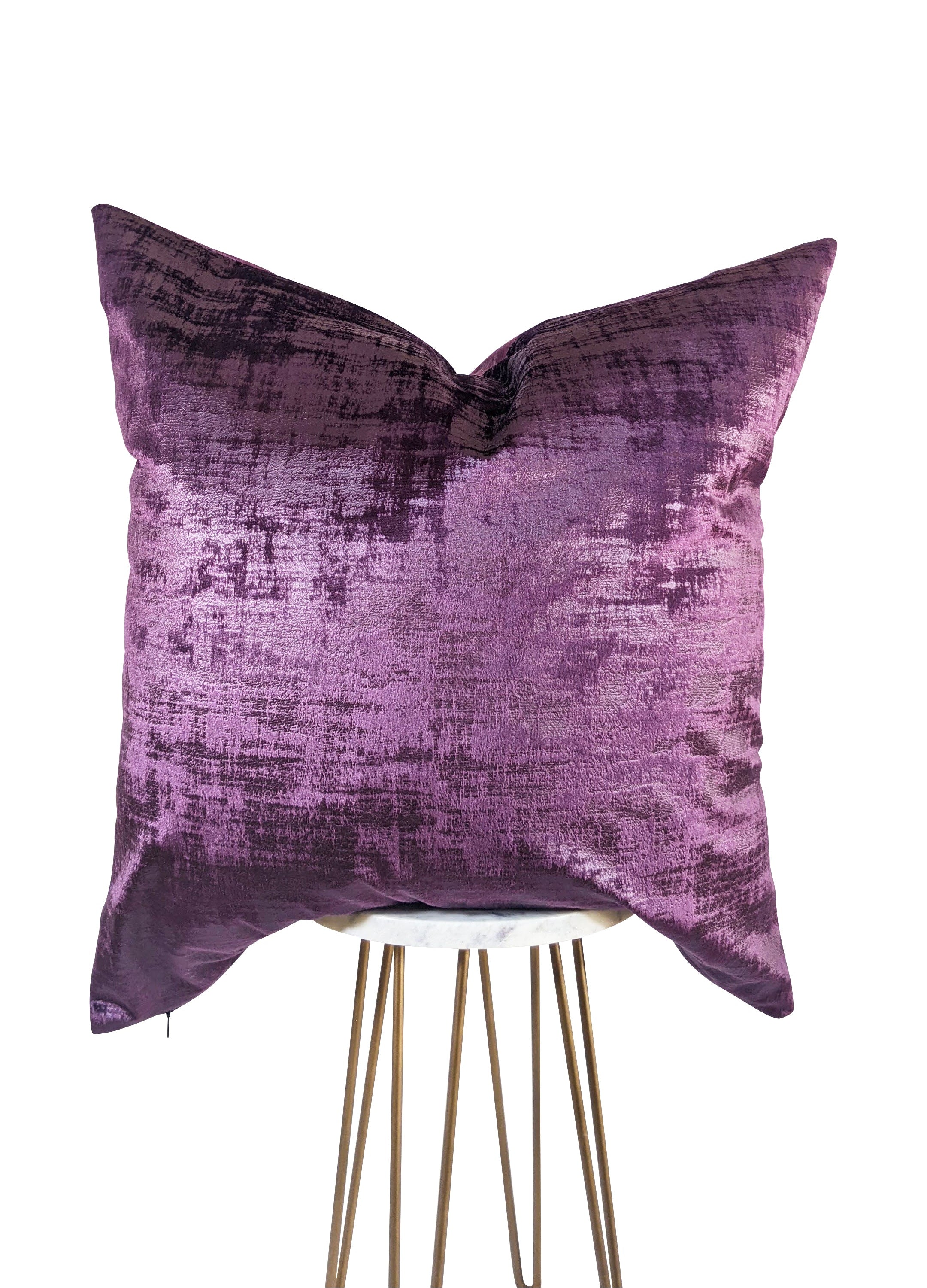 Purple textured pillow on a white background