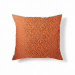 An orange chenille throw pillow with a cracked design, featuring various square and triangular shapes created by olive brown lines on a white background.