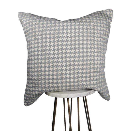 off white and light gray 20x20 square throw pillow with houndstooth design throughout, displayed on small white table.