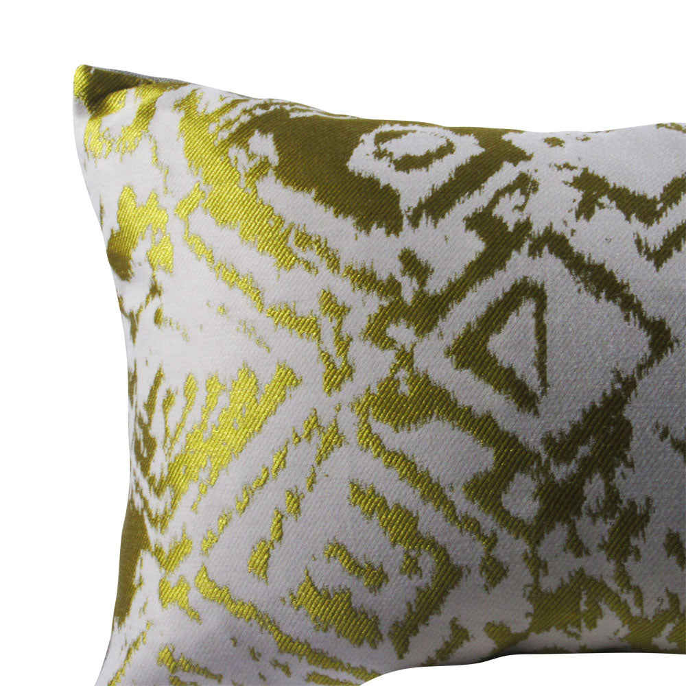 up-close view of shiny gold square throw pillow with geometric designs 