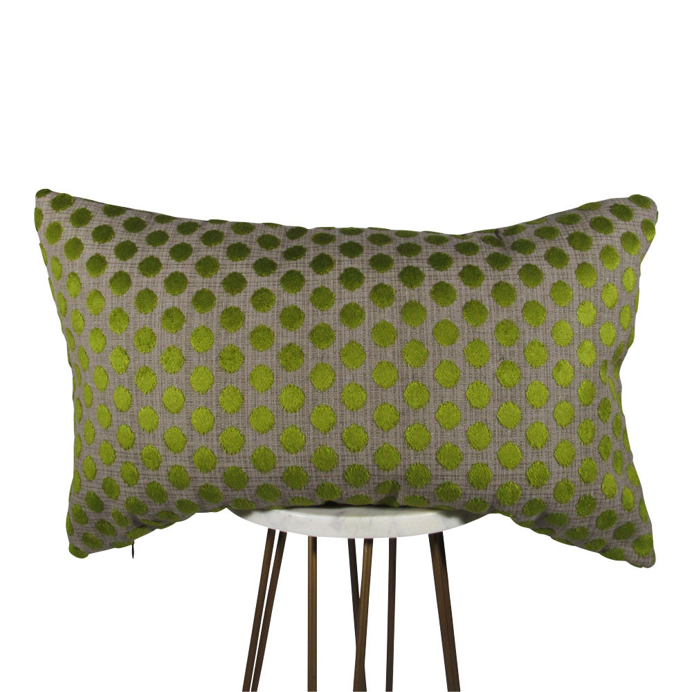 small velvet green dots on a gray backdrop 13x21 rectangle throw pillow,  displayed on small white table.