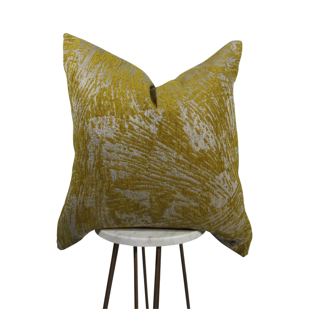 yellow and light gray 20x20 square throw pillow with abstract design throughout, displayed on small white table.