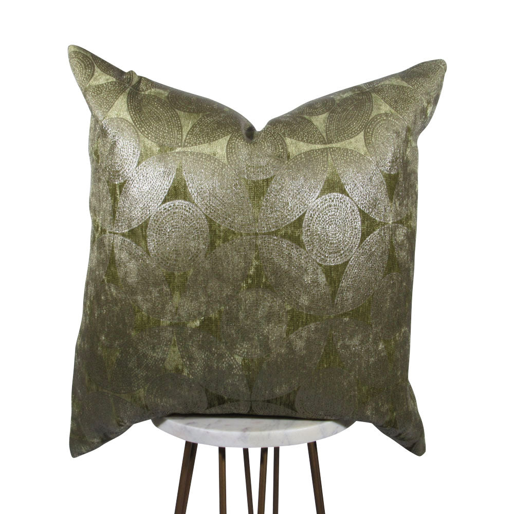 Square olive circles pillow cover styled on a neutral table 